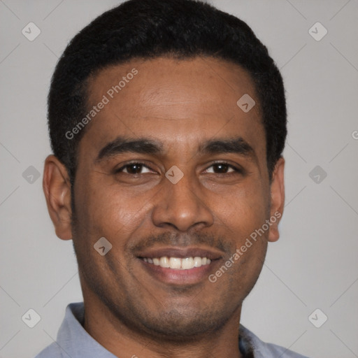 Joyful latino young-adult male with short  brown hair and brown eyes