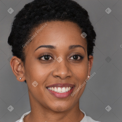 Joyful black young-adult female with short  brown hair and brown eyes