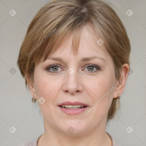 Joyful white adult female with medium  brown hair and grey eyes