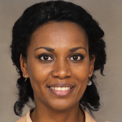 Joyful black young-adult female with medium  black hair and brown eyes