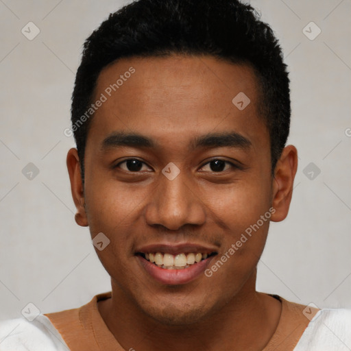 Joyful latino young-adult male with short  black hair and brown eyes