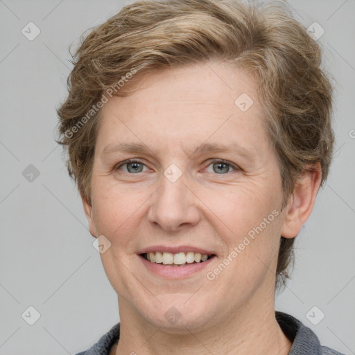 Joyful white adult female with short  brown hair and grey eyes