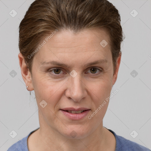 Joyful white adult female with short  brown hair and grey eyes