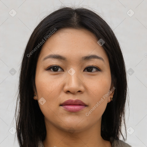 Joyful asian young-adult female with long  brown hair and brown eyes