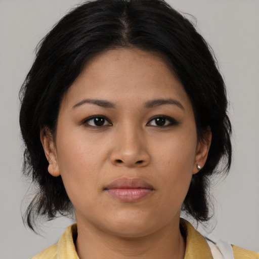 Neutral asian young-adult female with medium  brown hair and brown eyes