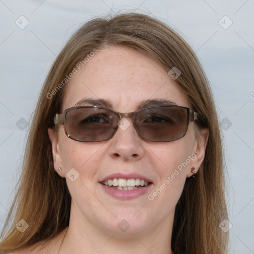 Joyful white young-adult female with long  brown hair and blue eyes