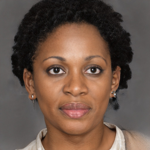 Joyful latino adult female with short  brown hair and brown eyes
