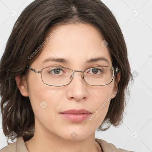 Joyful white young-adult female with medium  brown hair and green eyes