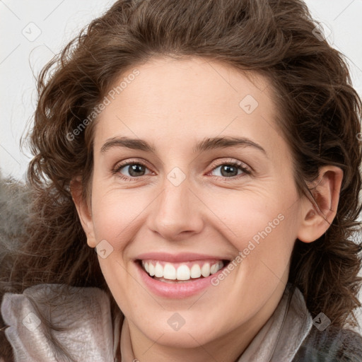 Joyful white young-adult female with medium  brown hair and green eyes