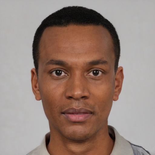 Neutral black young-adult male with short  black hair and brown eyes