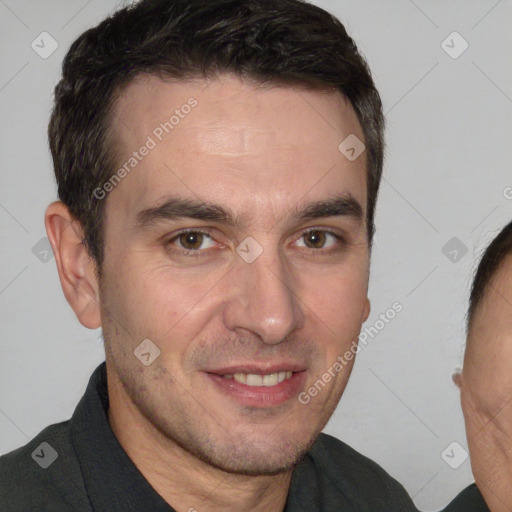 Joyful white adult male with short  brown hair and brown eyes