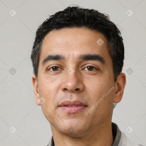Neutral white young-adult male with short  black hair and brown eyes
