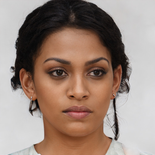 Neutral latino young-adult female with medium  brown hair and brown eyes