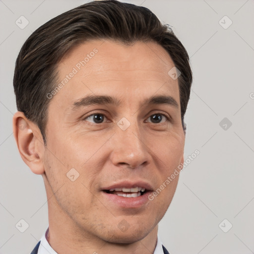 Joyful white adult male with short  brown hair and brown eyes