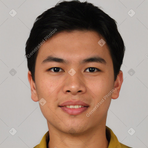 Joyful asian young-adult male with short  black hair and brown eyes