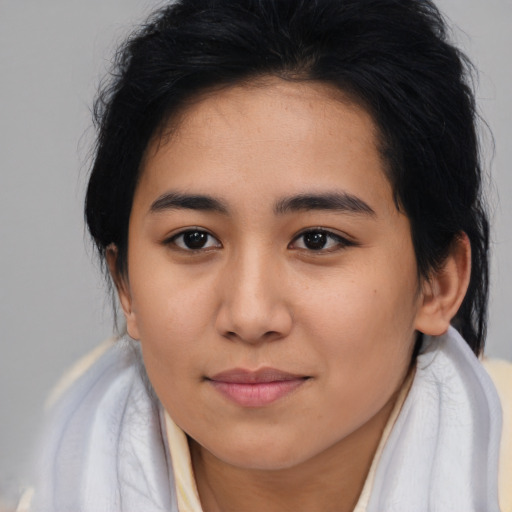 Joyful asian young-adult female with medium  brown hair and brown eyes