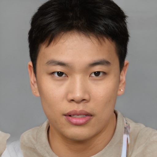 Neutral asian young-adult male with short  brown hair and brown eyes