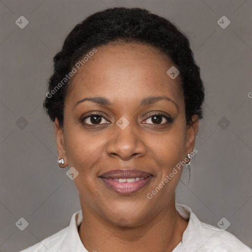 Joyful black adult female with short  brown hair and brown eyes