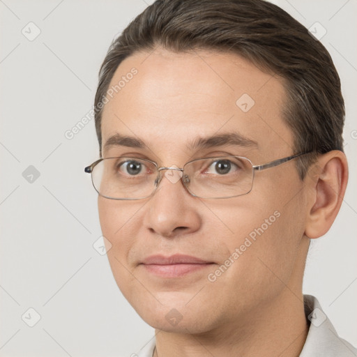 Joyful white adult male with short  brown hair and brown eyes