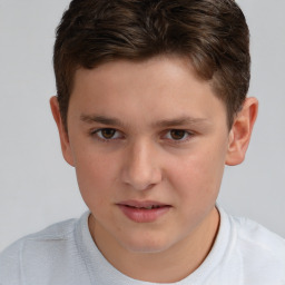 Joyful white child male with short  brown hair and brown eyes