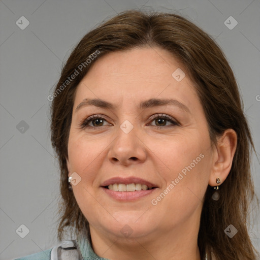 Joyful white adult female with medium  brown hair and grey eyes