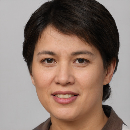 Joyful white young-adult female with medium  brown hair and brown eyes