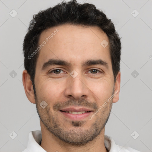 Joyful white young-adult male with short  black hair and brown eyes