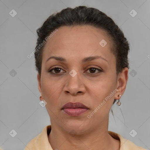 Joyful latino adult female with short  brown hair and brown eyes