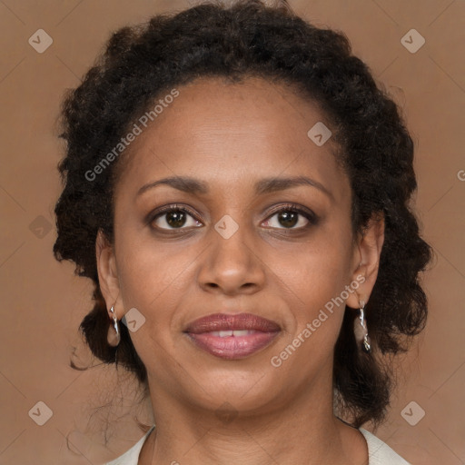 Joyful black young-adult female with medium  brown hair and brown eyes