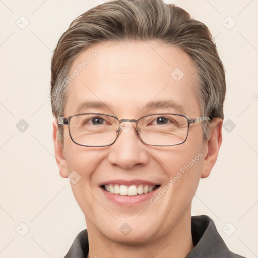 Joyful white adult male with short  brown hair and grey eyes