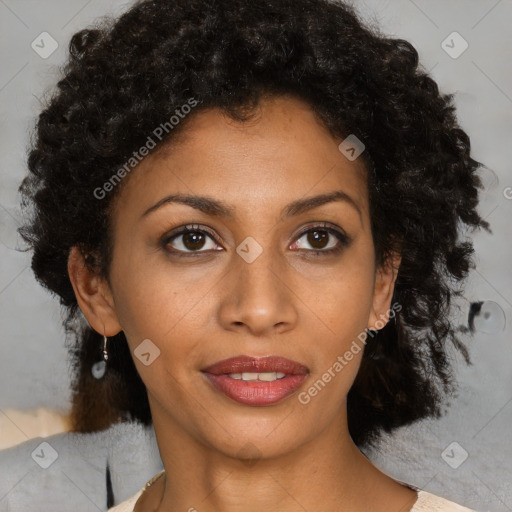 Joyful black young-adult female with medium  brown hair and brown eyes