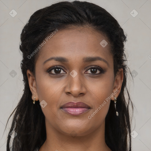 Joyful black young-adult female with long  brown hair and brown eyes