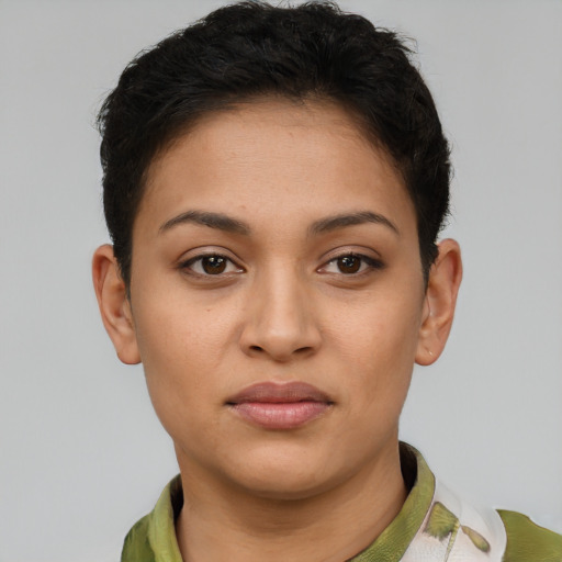 Joyful latino young-adult female with short  brown hair and brown eyes