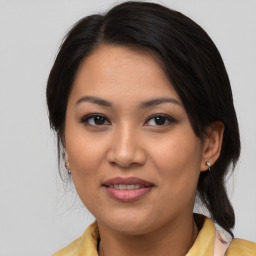 Joyful asian young-adult female with medium  brown hair and brown eyes