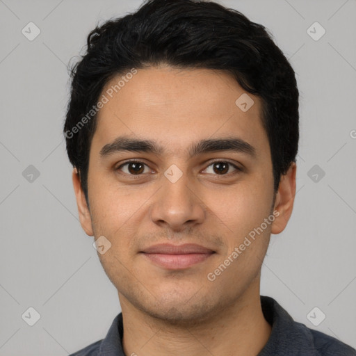 Joyful latino young-adult male with short  black hair and brown eyes