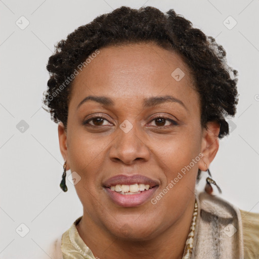 Joyful black adult female with short  brown hair and brown eyes