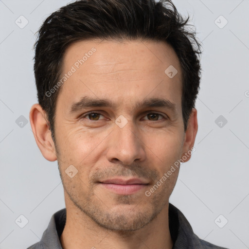 Joyful white adult male with short  brown hair and brown eyes