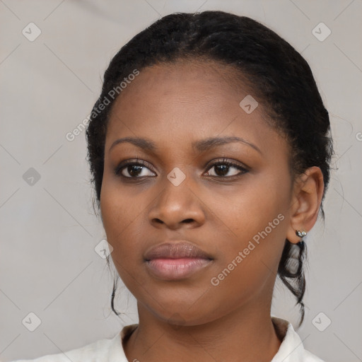 Neutral black young-adult female with medium  black hair and brown eyes