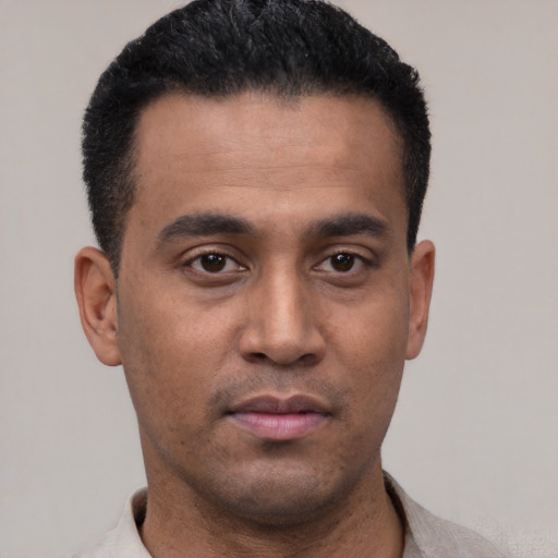 Neutral latino young-adult male with short  black hair and brown eyes