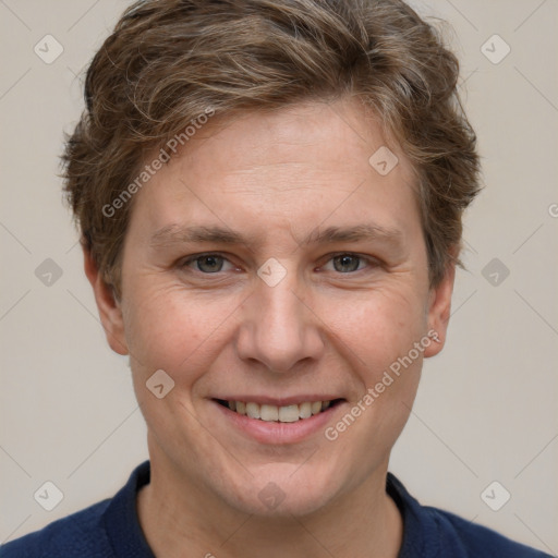 Joyful white adult female with short  brown hair and grey eyes