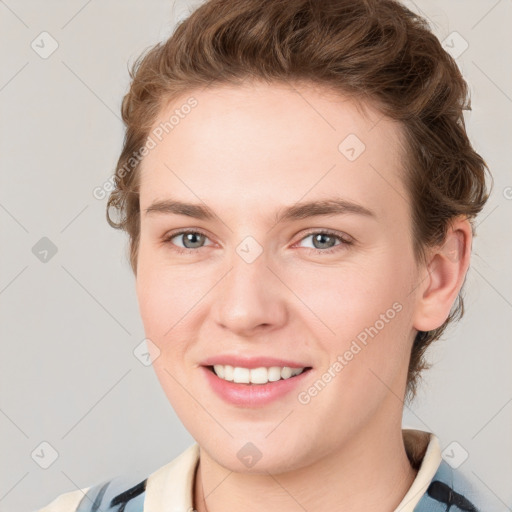 Joyful white young-adult female with short  brown hair and grey eyes