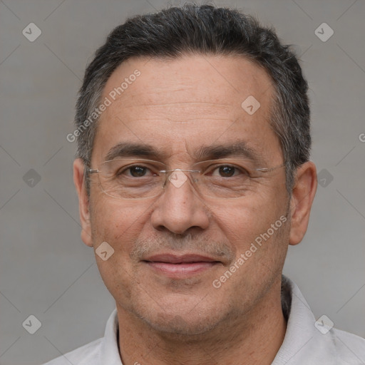 Joyful white adult male with short  black hair and brown eyes