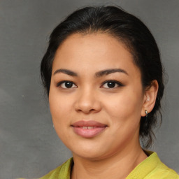 Joyful latino young-adult female with medium  brown hair and brown eyes