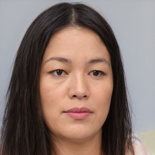 Neutral asian young-adult female with long  brown hair and brown eyes