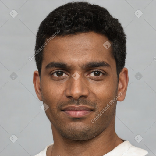 Joyful black young-adult male with short  black hair and brown eyes