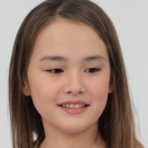 Joyful white child female with long  brown hair and brown eyes