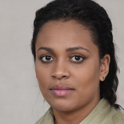 Neutral black young-adult female with medium  black hair and brown eyes