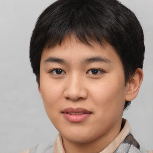 Joyful asian young-adult female with short  brown hair and brown eyes
