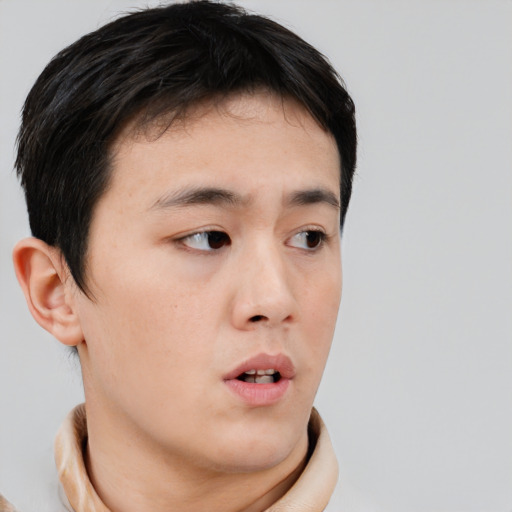 Neutral asian young-adult male with short  brown hair and brown eyes