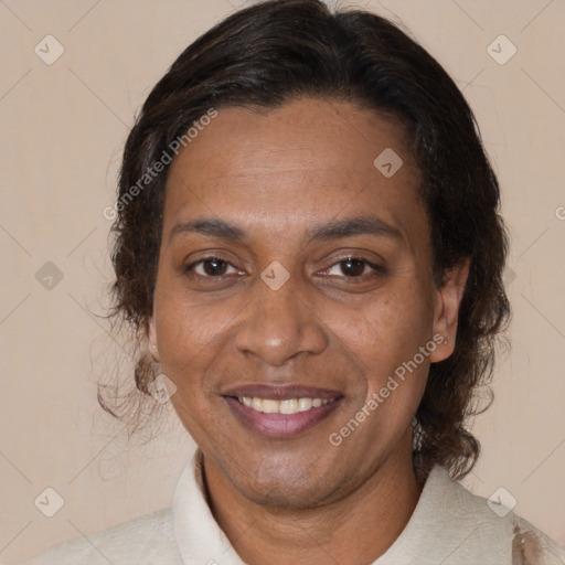 Joyful black adult female with medium  brown hair and brown eyes